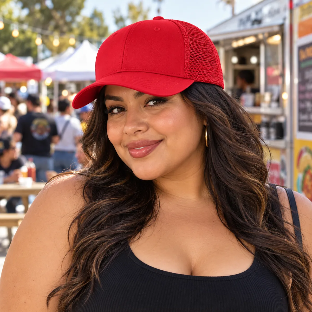 Woman wearing a red blank Flexfit 6-Panel Trucker Cap at a street market.