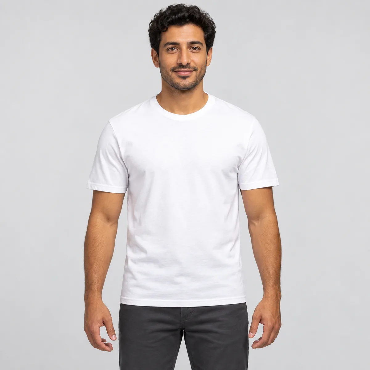 Model wearing a blank white Gildan Softstyle unisex T-shirt, front view.