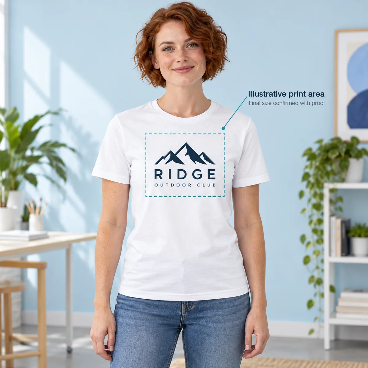 Model wearing a white Gildan Softstyle T-shirt with sample Ridge artwork inside an illustrative print-area boundary.