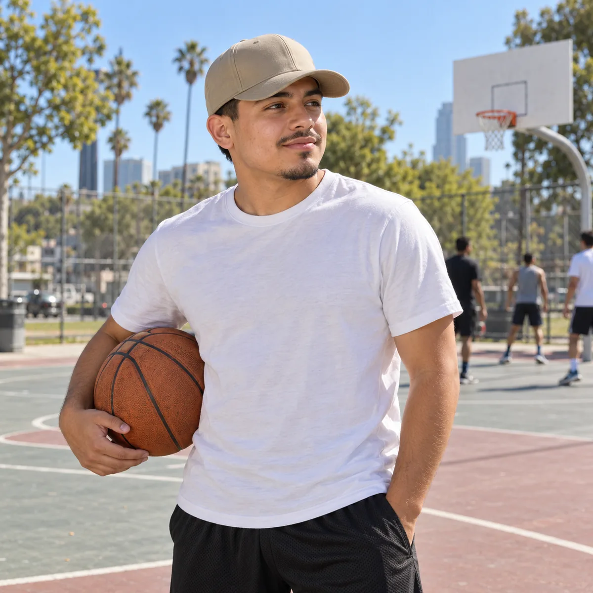 Latino man wearing a khaki Sportsman structured baseball cap at an urban skatepark.