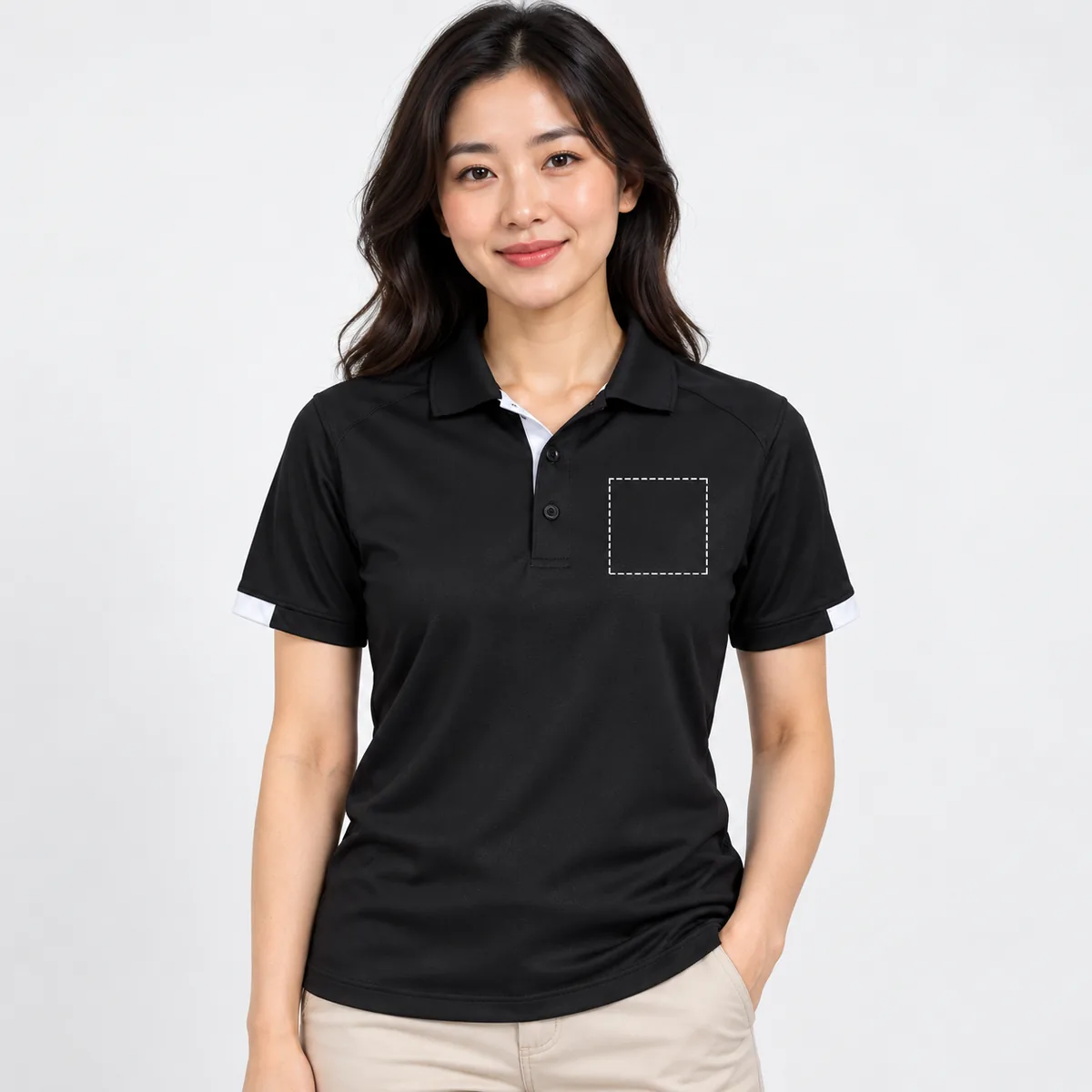 Woman wearing the Black/White TRIMARK Kiso Polo with an illustrative dashed left-chest print area; dimensions are not verified.